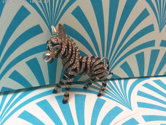Vintage Lisner Art Deco revival brooch Zebra with detailed green, white and black stones, missing few