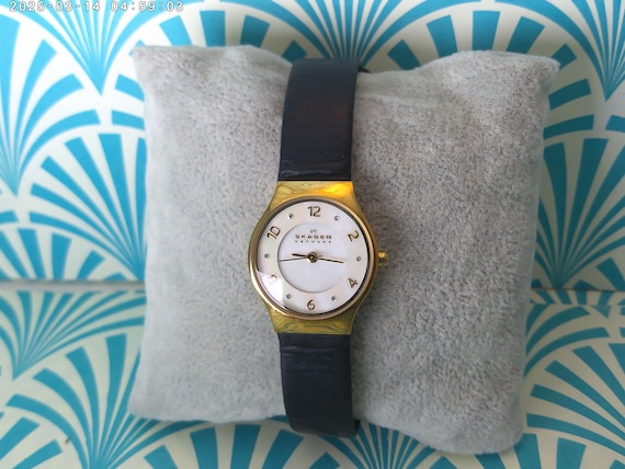 Vintage Skagen Denmark watch for women SKW2209 gold tone, black leather band pearl tone face, crystal details Works. beautiful and classic