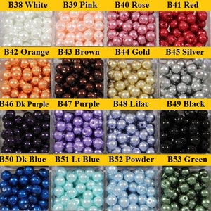 May include: Assortment of 12 colors of pearl beads in small plastic containers. The colors are white, pink, rose, red, orange, brown, gold, silver, dark purple, purple, lilac, black, dark blue, light blue, powder blue, and green.