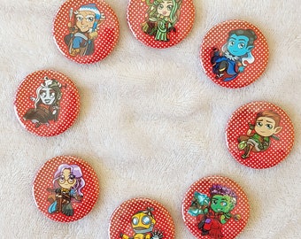 May include: Eight red and white polka dot buttons with various cartoon characters and designs. The characters include a robot, a goblin, a wizard, a dragon, a gnome, a fairy, and a mermaid.