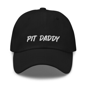 May include: Black baseball cap with white embroidered text that reads "PIT DADDY".