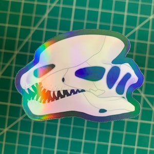 Holographic Dilophosaurus Skull Sticker | Iridescent Sticker | Rainbow Sticker | Dinosaur Skull Sticker | Vulture Culture Sticker