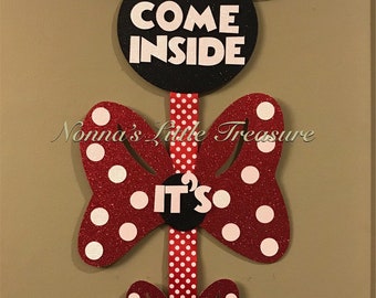 May include: A red and black Minnie Mouse themed door hanger with the text "Come Inside", "It's", and "Fun Inside".