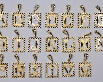 May include: A collection of gold-colored initial pendants, each featuring a different letter of the alphabet. The letters are in a stylized font and set within a square frame with a decorative border. The pendants have a loop for a chain.