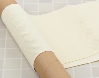 Ribete elástico de punto color crema para cinturilla, puños y cuello, ideal para ribetear chaquetas y sudaderas.