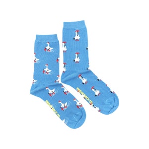 May include: A pair of blue socks with a white goose wearing a red hat and holding an umbrella pattern. The socks have the text "Friday Sock Co." on the bottom.