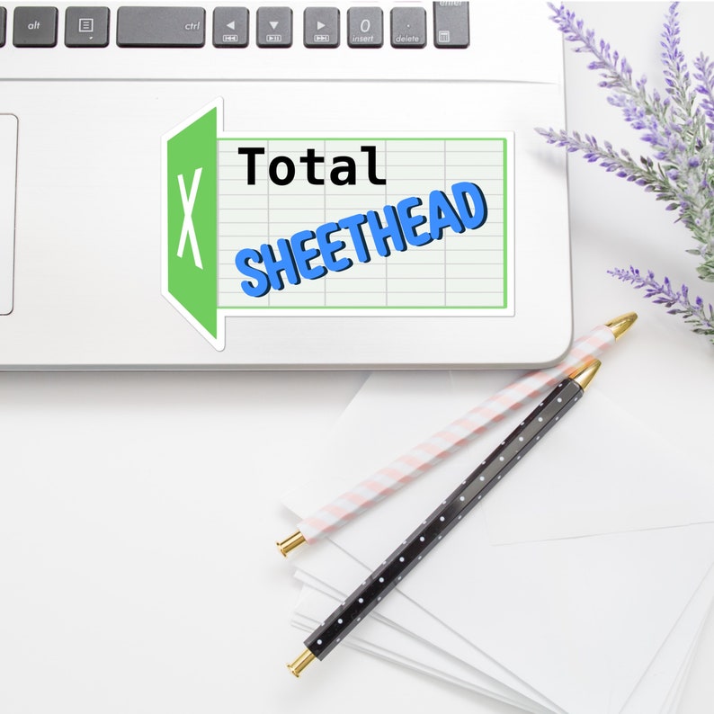 May include: A green and white sticker with a spreadsheet icon and the text "Total Sheethead" on a laptop computer.