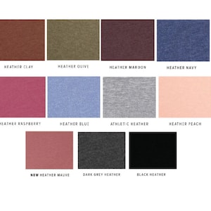 May include: A color chart showing different heather and solid colors of fabric. The colors include heather clay, heather olive, heather maroon, heather navy, heather raspberry, heather blue, athletic heather, heather peach, new heather mauve, dark grey heather, and black heather.