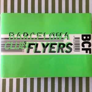 May include: A bright green booklet with the words "BARCELONA CLUB FLYERS" in black and white. The letters are stacked on top of each other. A barcode and the letters "BCF" are on the right side.