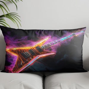 May include: A black pillow with a neon orange and blue electric guitar on a dark purple and blue smoke background.