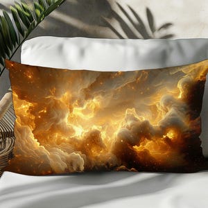 May include: Rectangular decorative pillow featuring a vibrant, abstract design of golden clouds and celestial light. The pillow is placed on a white surface, with a wicker chair and green plant in the background. The pillow's design evokes a sense of warmth and wonder.