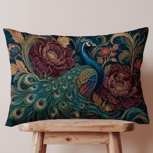 May include: A rectangular throw pillow featuring a vibrant peacock with iridescent blue and green plumage, surrounded by large, deep purple peony flowers and swirling golden-brown foliage set against a dark navy blue background.