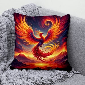 May include: A vibrant throw pillow featuring a fiery phoenix rising from a volcanic landscape. The phoenix is depicted in shades of orange, red, and yellow, with its wings spread wide. The background is a dramatic scene of erupting volcanoes and a swirling sky.