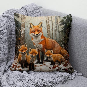 May include: A red fox with three kits in a snowy forest setting. The fox family is standing on a snowy patch with fallen leaves. The background is a blurry image of a forest with trees and snow.