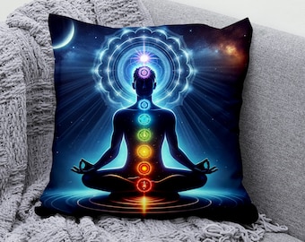 May include: A throw pillow with a colorful illustration of a person meditating with seven chakras, surrounded by a glowing mandala and a starry night sky.