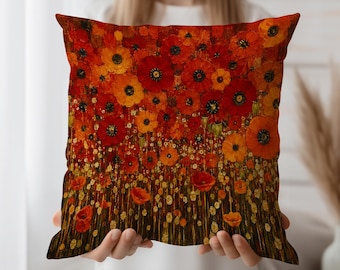 May include: Square cushion with a vivid floral design. The cushion displays a field of red and orange poppies with yellow highlights. The artwork has a textured, painted appearance, creating a warm and inviting aesthetic.