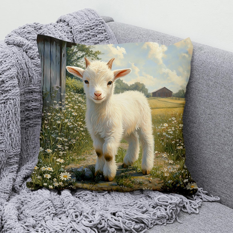 May include: A white baby goat with brown hooves stands in a field of wildflowers. The goat is looking at the camera with a curious expression. The background is a blurry image of a farm with a barn in the distance.