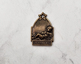 Réplica antigua de la medalla del Niño Jesús