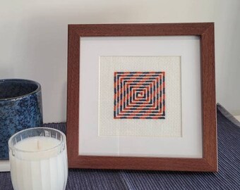 Abstract cross stitch labyrinth, textile art, blue and orange, framed