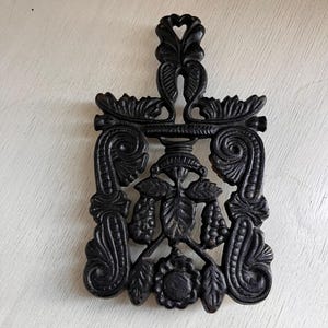 cast iron vintage trivet