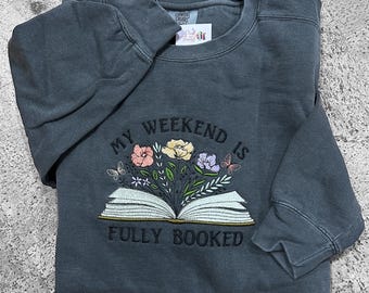 Embroidered floral book crewneck sweatshirt with my weekend is fully booked