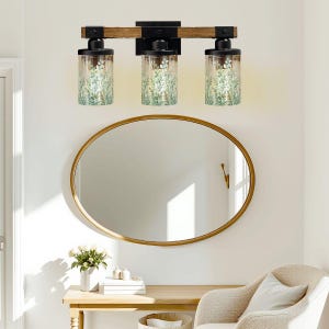 Upgrade your space with a Bathroom Vanitylight designed as a 3 Light Wood Vanity Light, blending a Rustic Vanity look with a Modern Vanity Wall Light style using Metal Glass and Colored Sconce accents for a Luxury finish.
