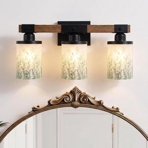 Upgrade your space with a Bathroom Vanitylight designed as a 3 Light Wood Vanity Light, blending a Rustic Vanity look with a Modern Vanity Wall Light style using Metal Glass and Colored Sconce accents for a Luxury finish.