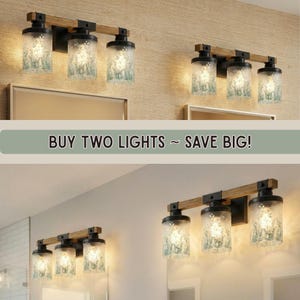 Elegant Bathroom Vanitylight with a Vanity Light Fixture including a 3 Light Wood Vanity Light, perfect for Rustic Vanity setups with Colored Sconce lighting and Modern Vanity Wall Light styling in Metal Glass for a Luxury touch.