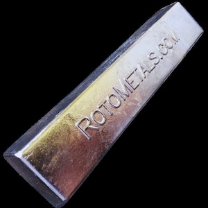 May include: A silver metal bar with the text "ROTOMETALS.COM" embossed on the top.