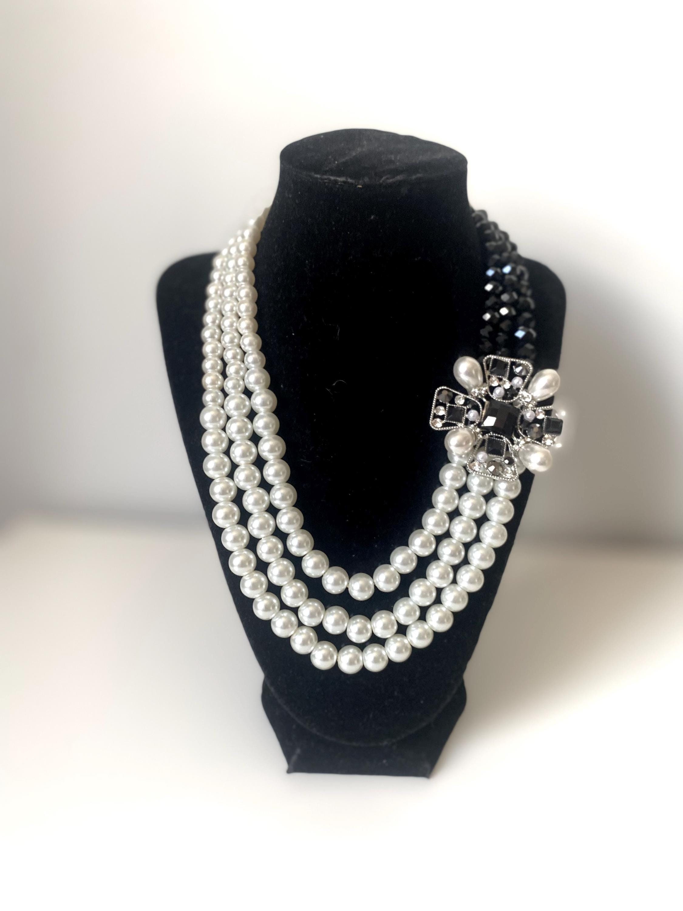 Ivory Pearl Multi Strand Necklace: Black Crystal Brooch Pendant
