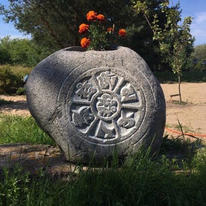 Stone with Buddhist mantra /Om Mani Pedme Hum/ Natural boulder, hand carving.