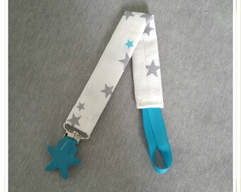 Attache tétines blanc à étoiles grises et bleues turquoise