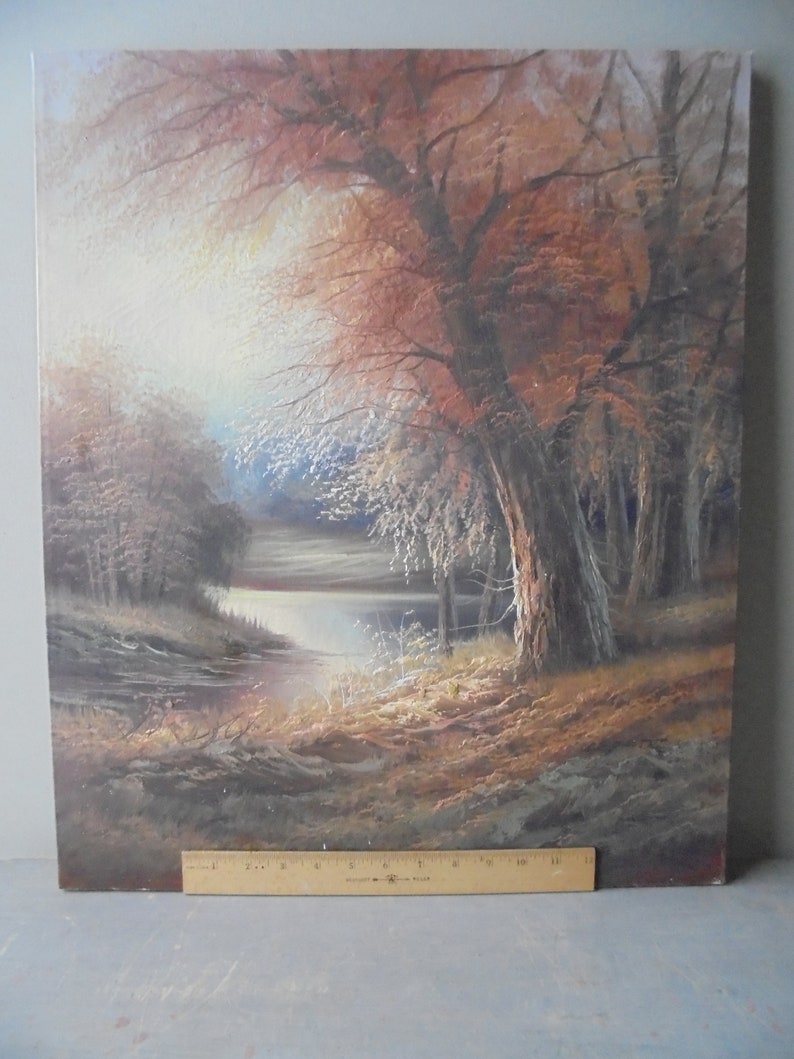May include: A painting of a forest scene with a lake in the background. The trees are in shades of brown and red, and the lake is a deep blue. The sun is shining through the trees, creating a warm glow.