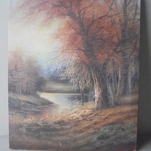 May include: A painting of a forest scene with a lake in the foreground. The trees are mostly brown and orange, with some green leaves. The lake is a light blue color, and the sky is a light gray. The painting is done in a realistic style.