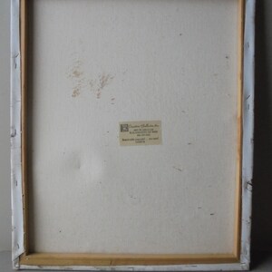 May include: The back of a stretched canvas painting with a white background and a small label that reads "Creative Galleries, Inc. 400 W. Michigan Ave. Kalamazoo, MI 49007 616-373-6441  Brand with your job - try our 182876"