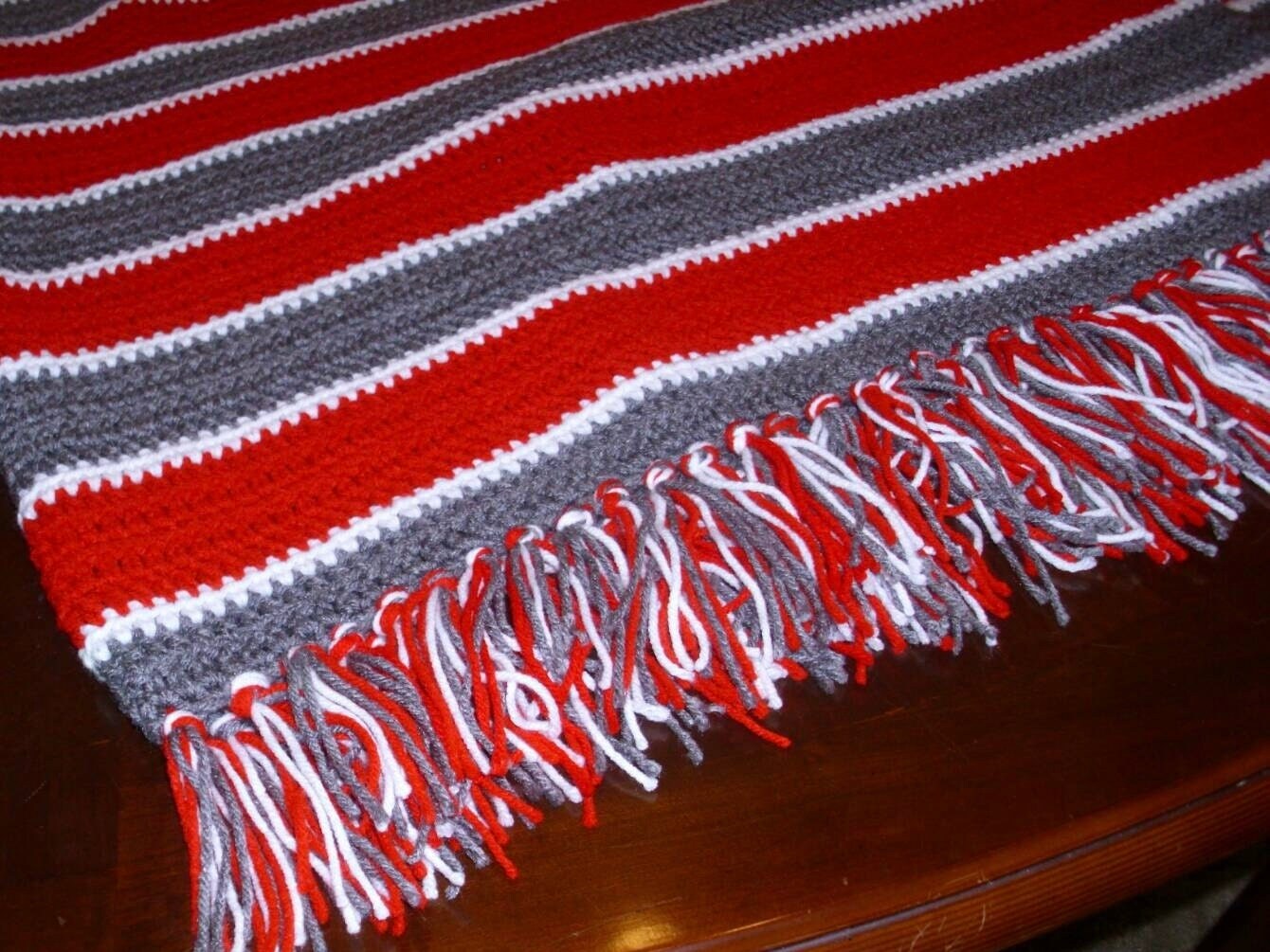 Ohio State Buckeyes themed afghan in red / scarlet and gray, with fringe on 4 sides. Ready to ship!
