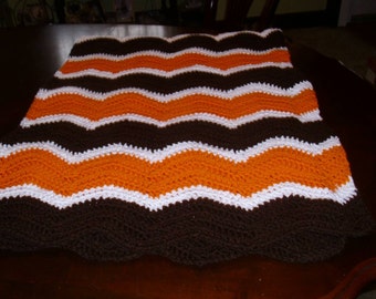 Brown and Orange Striped wavy chevron afghan.  Cleveland Browns themed afghan.  Chevron style brown and orange afghan.