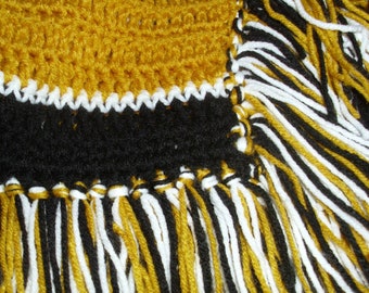 Pittsburgh Steelers, Penguins, Pirates themed striped afghan in black and gold with fringe on four sides.