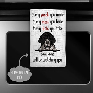 May include: White kitchen towel with a black and white dog graphic and the text "Every snack you make, Every meal you bake, Every bite you take, GUNNER will be watching you." The towel is personalized.
