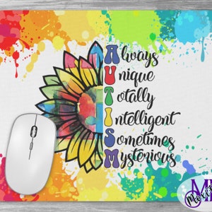 May include: A colorful mousepad with a sunflower design and the word "AUTISM" spelled out with the letters representing the words "Always Unique Totally Intelligent Sometimes Mysterious".
