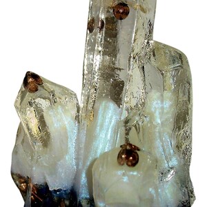 May include: A cluster of clear quartz crystals with copper-colored inclusions and accents. The crystals have a pearly white base with dark blue and copper-colored elements at the bottom. The crystals are arranged in a vertical formation.