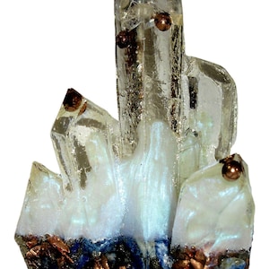 May include: A clear quartz crystal cluster with copper accents and a white base. The crystal has multiple points and is partially coated in a white, iridescent material. The base features copper and blue mineral fragments.