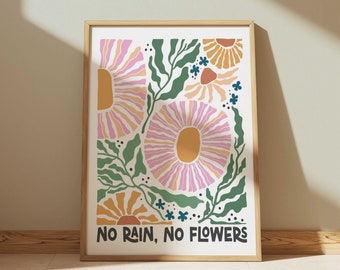 May include: A framed print with a floral design in shades of pink, yellow, and green. The print features a stylized flower with the text "No Rain, No Flowers" at the bottom.