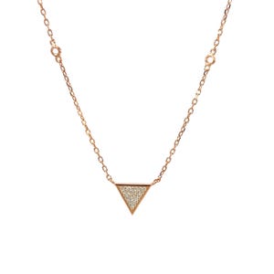 May include: Rose gold necklace featuring a triangle pendant encrusted with small, sparkling stones. The delicate chain is connected to the pendant, creating a minimalist and elegant design. The necklace is displayed against a white background.