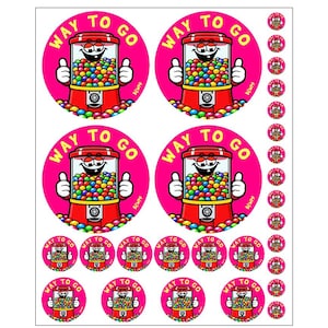 May include: Sheet of stickers featuring a cartoon gumball machine with the text "WAY TO GO" on a pink background. The gumball machine is red with a smiling face and thumbs up. Smaller stickers of the same design are also included.