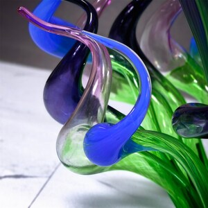 Close-up of the seamless color gradient from green to blue to purple, showcasing the masterful glassblowing technique in this abstract sculpture