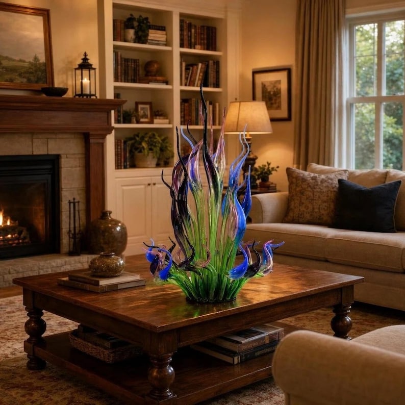 Hand-blown glass sculpture with green, blue, purple and black flame-like forms, styled as modern home decor
