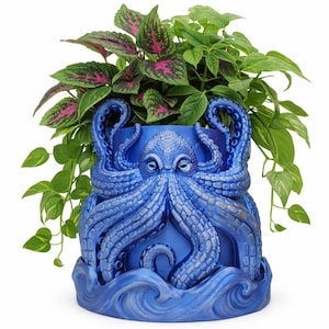 May include: A blue octopus-shaped planter with a detailed design, holding green and pink foliage. The planter features a textured surface and a wave-like base. A unique decorative item for indoor or outdoor use.