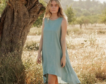 Teal blue linen dress Royal Toscana. Asymmetrical, sleeveless, loose, knee-length linen summer dress. Women's clothing.