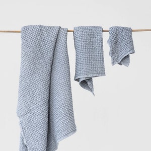 Linen towel set in waffle, light gray color: hand, face, body linen towels. Absorbent bath towels.